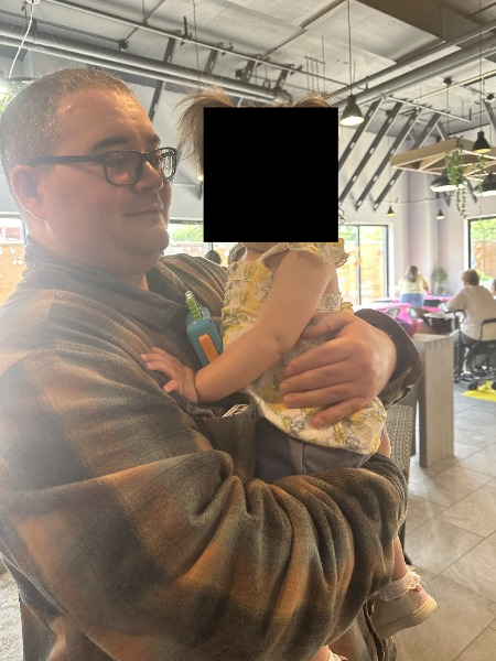 Photo of me holding my baby niece.